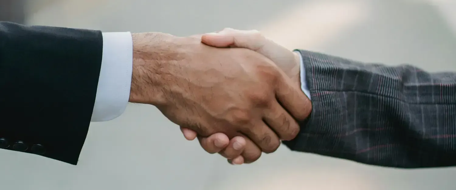 [Photo by Ketut Subiyanto](https://www.pexels.com/photo/businessmen-shaking-hands-4963445/)