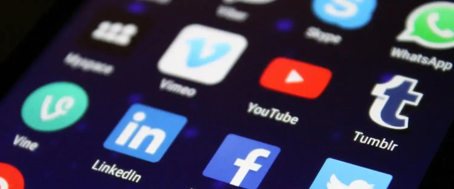 Photo of a mobile phone with Social Media icons