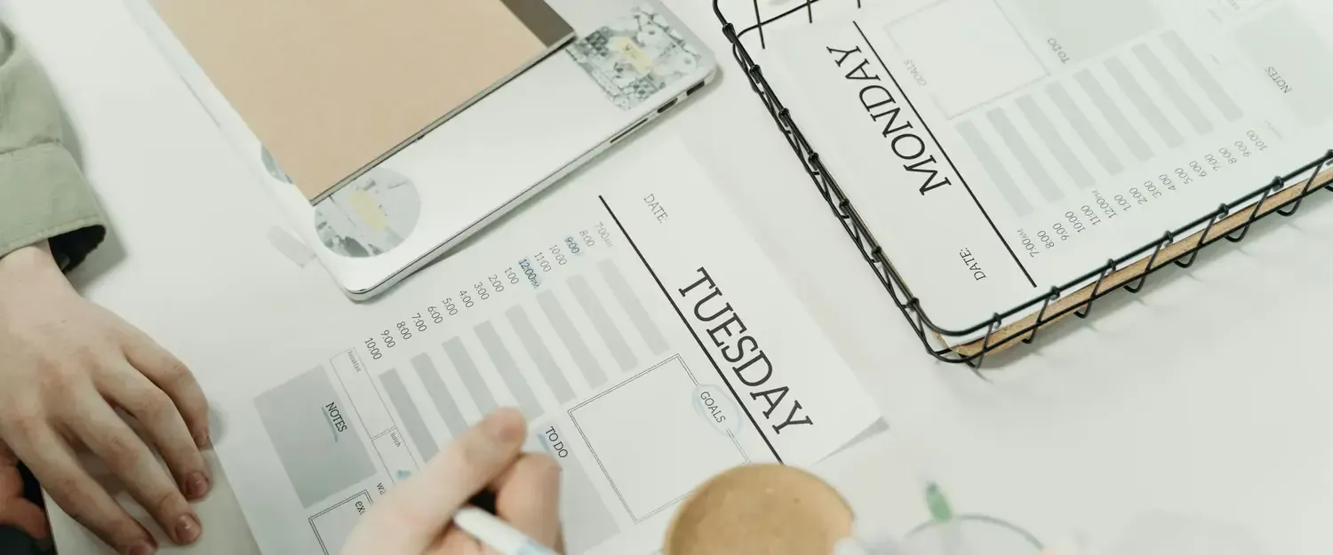 Photography of someone working with task lists