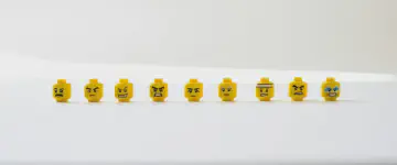 Lego heads showing different angry facial expressions