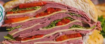 A photo of sandwitch with many layers, symbolizing Docker layers